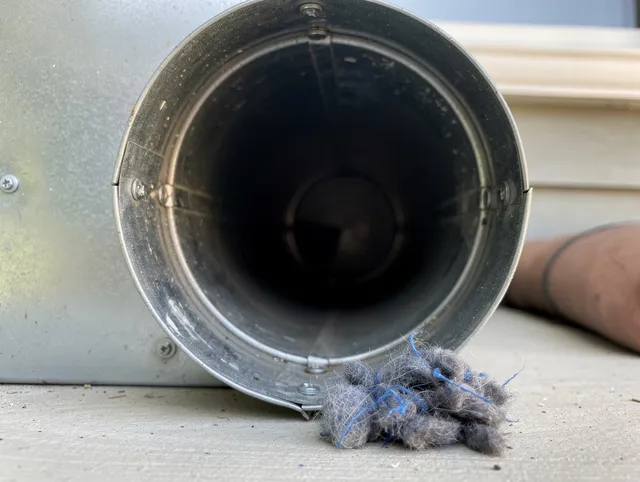 Somerset Dryer Vent Cleaning technician using specialized equipment to clear severe dryer vent blockage in Somerset